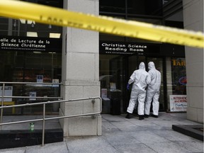 Police tape in front of 141c Laurier Ave in Ottawa Friday May 25, 2018. A woman was found bloodied and beaten inside the office at the Christian Science Reading Room at 141c Laurier Ave. West, Thursday.