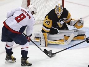 Washington Capitals' Alex Ovechkin (8) has a shot stopped by Pittsburgh Penguins goaltender Matt Murray (30) during the first period in Game 6 of an NHL second-round hockey playoff series in Pittsburgh, Monday, May 7, 2018.