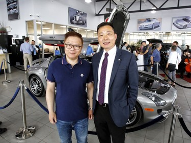 Henry Yeung of Sun Life Financial and George Yin, sales and leasing consultant at Star Motors of Ottawa.