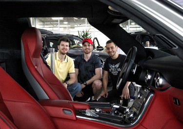From left, Abdul Kassab, Adnan Kassab and Ahmed Abdrabou admire one of the cars at Benzfest.