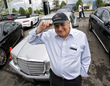 Ray Pearmain stands in front of Mercedes-Benz car models that were on show at Benzfest.