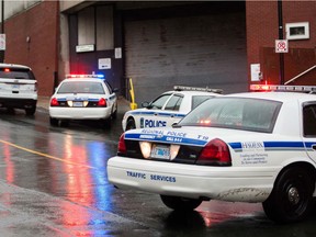 Police cars stop outside a bank in Halifax, NovaScotia.