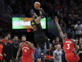 LeBron James #23 of the Cleveland Cavaliers celebrates his game winning shot with Kevin Love #0 next to Serge Ibaka #9 of the Toronto Cleveland Cavaliers' LeBron James (23) hits the game-winning shot as Toronto Raptors' OG Anunoby (3) and CJ Miles (0) watch during the second half of Game 3 of an NBA basketball second-round playoff series, Saturday, May 5, 2018, in Cleveland. The Cavaliers defeated the Raptors 105-103.