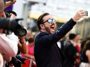 Ricky Gervais takes a selfie at the Emmy Award on September 20, 2015 in Los Angeles, California.