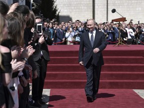 Russian President Vladimir Putin walks after the inauguration ceremony in the Kremlin in Moscow, Russia, on Monday, May 7, 2018.