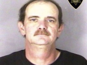 This undated booking photo provided by the Marion County Sheriff's Department in Oregon where Stephen Houk is wanted. Houk who Authorities are searching for Houk, a paroled sex offender, who lead them on an hours-long chase Tuesday, Mat 2, 2018 through California in a motor home with his two young children inside.