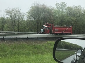 A dump truck sits near the scene after a collision with a school bus in Mount Olive, N.J., Thursday, May 17, 2018.