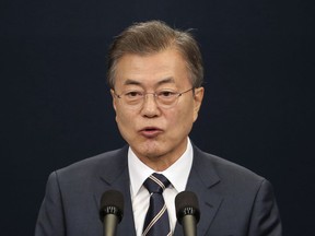 South Korean President Moon Jae-in speaks during a press conference at the presidential Blue House in Seoul, South Korea, Sunday, May 27, 2018. President Moon said North Korean leader Kim Jong Un remains committed to holding a summit with President Donald Trump and to the "complete denuclearization of the Korean Peninsula."