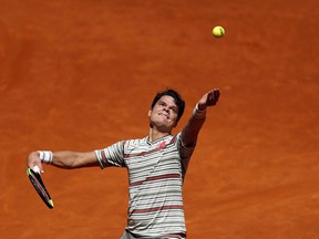 Milos Raonic has pulled out of the French Open. It's the latest setback in a frustrating tennis season for the product of Thornhill, Ont. Raonic serves during a Madrid Open tennis tournament match against fellow Canadian Denis Shapovalov, in Madrid on Thursday, May 10, 2018.