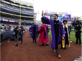 Prime Minister Justin Trudeau takes part in the procession prior to delivering the commencement address to New York University graduates at Yankee Stadium in New York on Wednesday, May 16, 2018.