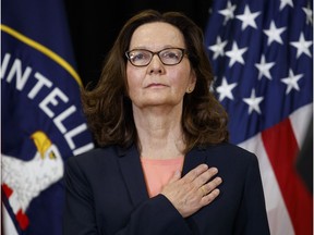 Incoming Central Intelligence Agency director Gina Haspel stands for the national anthem during her swearing-in ceremony at CIA Headquarters, Monday, May 21, 2018, in Langley, Va.