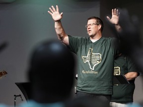 Dayspring Church senior pastor Brad Drake leads his congregation in prayer Sunday, May 20, 2018, in Santa Fe, Texas. Congregations in this deeply religious community near Houston gathered Sunday for their first worship services since a teenager with a shotgun blasted his way into a high school art classroom and killed 10 people -- eight students and two teachers.