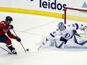 Washington Capitals center Lars Eller (20), from Denmark, has his shot knocked away by Tampa Bay Lightning goaltender Andrei Vasilevskiy (88), from Russia, during the third period of Game 6 of the NHL Eastern Conference finals hockey playoff series, Monday, May 21, 2018, in Washington. The Capitals won 3-0.