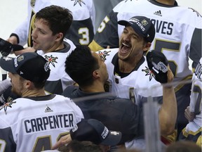 Vegas Golden Knights defenceman Luca Sbisa hugs a team member after they defeated the Winnipeg Jets in the Western Conference final in Winnipeg on Sun., May 20, 2018.