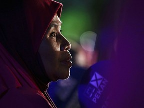 A supporter of Malaysian Prime Minister Najib Razak listens during his last campaign rally at his house in Pekan, Pahang state, Malaysia, a day before the national elections on Tuesday, May 8, 2018. The scandal-plagued Prime Minister Najib is seeking a third term in office during the May 9 general election, but faces an unprecedented challenge from a rejuvenated opposition led by his former mentor and strongman Mahathir Mohamad.