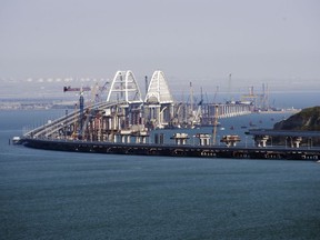 A view of the new bridge across the Kerch Strait linking Russia's Taman Peninsula with Crimea, after regular traffic began, in Kerch, Crimea, Wednesday, May 16, 2018. The 19-kilometer (11.8-mile) bridge, which took two years to build and cost $3.6 billion is Putin's project to show that Crimea has joined Russia for good. (AP Photo)