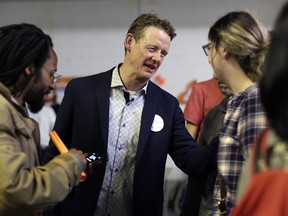 Joel Harden of the NDP celebrates his victory over longtime Ottawa Centre MPP Yasir Naqvi with supporters on Thursday night.