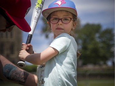 National Little League week kicked off with two teams coming together for a game of T-Ball on the lawn of Parliament Hill Sunday June 10, 2018. Five-year-old Jéza-Belle Drouin takes a swing Sunday afternoon.   Ashley Fraser/Postmedia