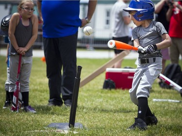 National Little League week kicked off with two teams coming together for a game of T-Ball on the lawn of Parliament Hill Sunday June 10, 2018. Six-year-old Dawson Aucoin takes a swing Sunday afternoon.   Ashley Fraser/Postmedia