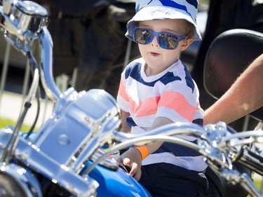Two-year-old Henry Hoogenraad checks out a motorcycle at the Touch A Truck event at Lincoln Fields Shopping Centre Sunday June 10, 2018.