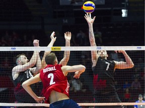 Canada played USA in the  FIVB Volleyball Nations League Sunday June 10, 2018 at TD Place Arena. Canada's #7 Stephen Timothy Maar tries to stop USA's #2 Aaron Russell's play.