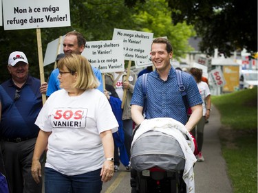 Residents opposed to the Salvation Army's plans for a new shelter and facility in Vanier took their message to the streets, marching through their community Sunday June 24, 2018. Mathieu Fleury Ottawa city councillor of Rideau-Vanier took part in the march Sunday.    Ashley Fraser/Postmedia