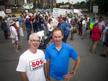 Residents opposed to the Salvation Army's plans for a new shelter and facility in Vanier took their message to the streets, marching through their community Sunday June 24, 2018. L-R Bruce McConville, campaign co-ordinator, SOS Vanier and Drew Dobson founder of SOS Vanier and the owner of Finnigan's Pub.