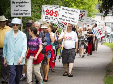 Residents opposed to the Salvation Army's plans for a new shelter and facility in Vanier took their message to the streets, marching through their community Sunday June 24, 2018.   Ashley Fraser/Postmedia