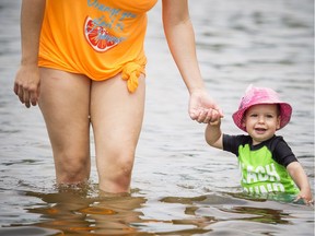 The hot weather that hit the capital Saturday was perfect for one-and-a-half-year-old Calin Janzen and Julia Janzen as they played in the water at Mooney's Bay beach.  Ashley Fraser/Postmedia