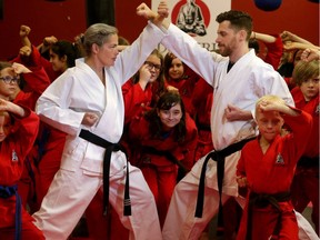 Brigitte Pellerin and Cody Driesbourg demonstrate sport karate at the Douvris Martial Arts studio.