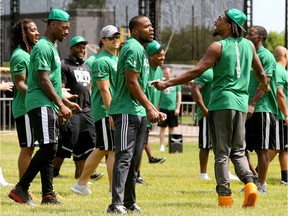 Duron Carter, right, and the Roughriders held a walkthrough on the Parliament Hill front lawn on Wednesday, June 20, 2018.