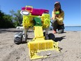 Erin Kennedy with Bowie the robot on Westboro Beach.