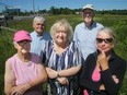 Agnes Warda (centre) is president of the Glens Community Association, which is upset by the proposal of a car dealership on a choice piece of land on at the corner of Prince of Wales and Hunt Club across from The Met church. About a 100 local residents (including, from left: Pat Logan, Jacek Warda, Dick de Jong and Loraine McInnes) showed up to a community meeting recently to discuss the use of the land, which Ms. Warda says the city promised would never sell to a car dealership.