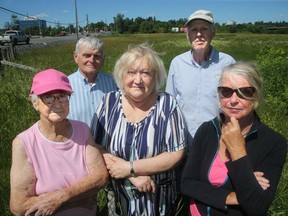 Agnes Warda (centre) is president of the Glens Community Association, which is upset by the proposal of a car dealership on a choice piece of land on at the corner of Prince of Wales and Hunt Club across from The Met church. About a 100 local residents (including, from left: Pat Logan, Jacek Warda, Dick de Jong and Loraine McInnes) showed up to a community meeting recently to discuss the use of the land, which Ms. Warda says the city promised would never sell to a car dealership.