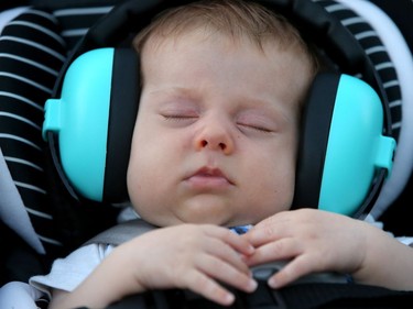 Eight-week-old Hap McWhinnie chilled out to Béla Fleck and the Flecktones, who performed at Jazzfest Thursday (June 28, 2018) on the main stage outside Ottawa City Hall.  Julie Oliver/Postmedia
