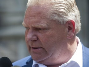 Premier-designate Doug Ford speaks to reporters on June 10.