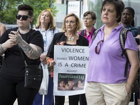 Women and men gathered at the Human Rights Monument on Friday, June 1, 2018 for a vigil to remember Elisabeth Salm and other victims of violence against women.