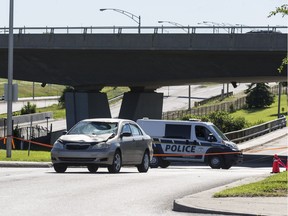 Scene of a police investigation in Gatineau on Boulevard Montclair where a man was struck by a car (pictured) while being chased by police. June 21, 2018. Errol McGihon/Postmedia