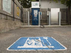 An electric vehicle charging station sits idle at the City of Ottawa parking lot at 687 Somerset Street. June 27, 2018. Errol McGihon/Postmedia