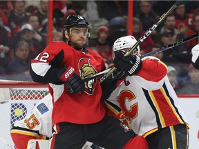 Marian Gaborik battles with Flames defenceman Mark Giordano in the Senators game at home on March 9. Jean Levac/Postmedia