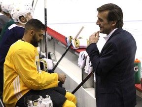 Golden Knights general manager George McPhee talks with team members during a practice session in Washington last week.