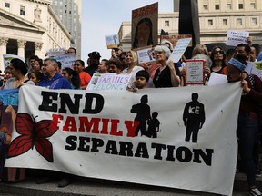 Hundreds of immigrant rights advocates and others participate in a rally in lower Manhattan June 1 against the Trump administration's policy that enables federal agents to take migrant children away from their parents at the border. Canada, too, puts migrant kids in detention.