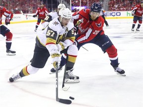 Lars Eller, right, of the Capitals tries to force David Perron of the Golden Knights off the puck during the third period in Game 3 on Saturday night.