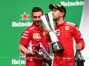 Race winner Sebastian Vettel of Germany and Ferrari celebrates on the podium during the Canadian Formula One Grand Prix at Circuit Gilles Villeneuve on June 10, 2018 in Montreal.