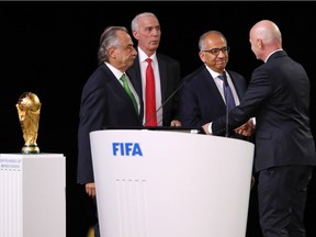 FIFA president Gianni Infantino (r) poses with the United 2026 bid (Canada, Mexico, US) officials: Left-Right president of the Mexican Football Association Decio de Maria Serrano and Steve Reed president of the Canadian Soccer Association president of the United States Football Association Carlos Cordeiro after the announcement of the host for the 2026 FIFA World Cup went to United 2026 bid during the 68th FIFA Congress at Moscow's Expocentre on June 13, 2018 in Moscow, Russia.