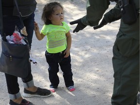 U.S. Border Patrol agents take Central American asylum seekers into custody on June 12, 2018 near McAllen, Texas. The immigrant families were then sent to a U.S. Customs and Border Protection (CBP) processing center for possible separation. U.S. border authorities are executing the Trump administration's zero tolerance policy towards undocumented immigrants. U.S. Attorney General Jeff Sessions also said that domestic and gang violence in immigrants' country of origin would no longer qualify them for political-asylum status.