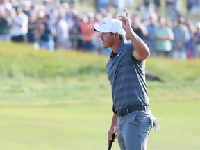 Brooks Koepka of the United States waves after putting on the 18th green during the final round of the 2018 U.S. Open at Shinnecock Hills Golf Club on June 17, 2018 in Southampton, New York.