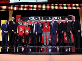 Jacob Bernard-Docker poses with Senators representatives after being selected 26th overall in the first round of the NHL draft on Friday night in Dallas.