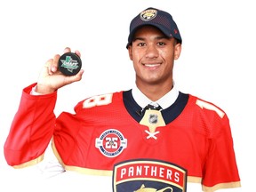 Serron Noel of Ottawa poses for photos after being selected 34th overall by the Panthers in the NHL draft on Saturday.