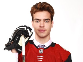 Kevin Bahl poses after being selected 55th overall by the Arizona Coyotes during the 2018 NHL draft in Dallas on Saturday.